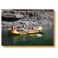 Picture of Matt Fahy gently rowing his boat with Larry and Kevin in the stern and Bill and Jennifer in the bow.