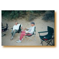 Picture of Bob Groves and Phil Roberts relaxing after dinner.